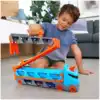 Игровой набор Hot Wheels Грузовик-автотрек Скоростная автотрасса с хранилищем для машинок GVG37